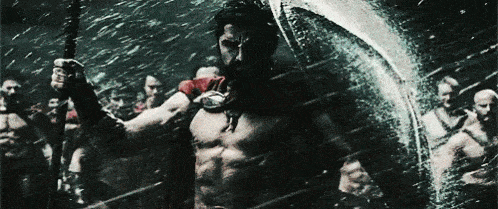 A gif from the movie 300 with leonidas holding a shield in the rain.