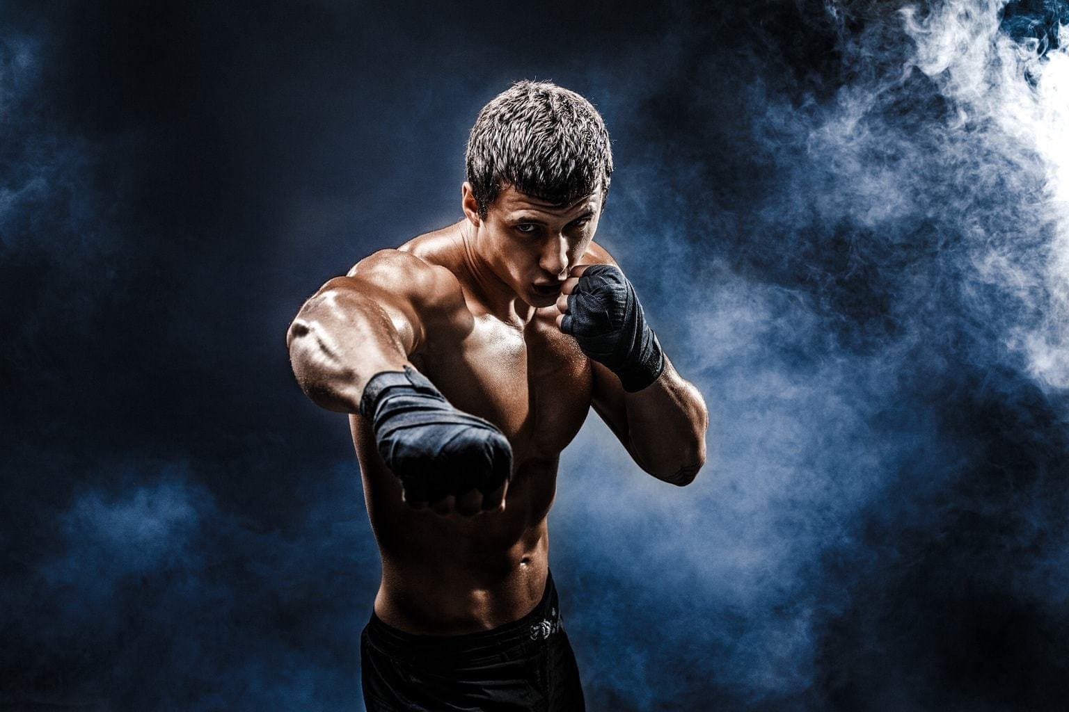 Strong muscular man boxing