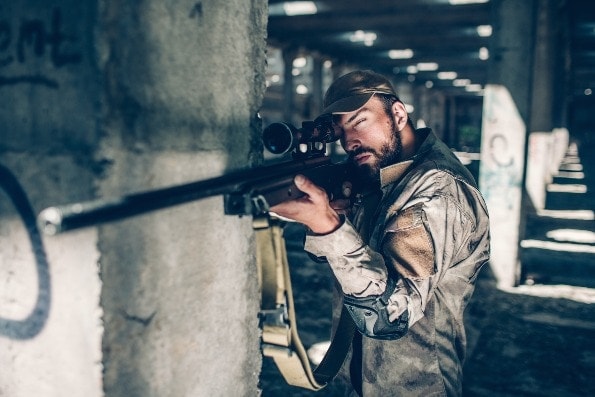 Soldier aiming through a sniper rifle