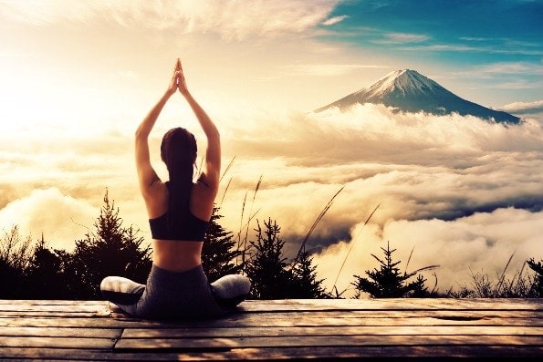 Woman Doing Yoga in the Mountains