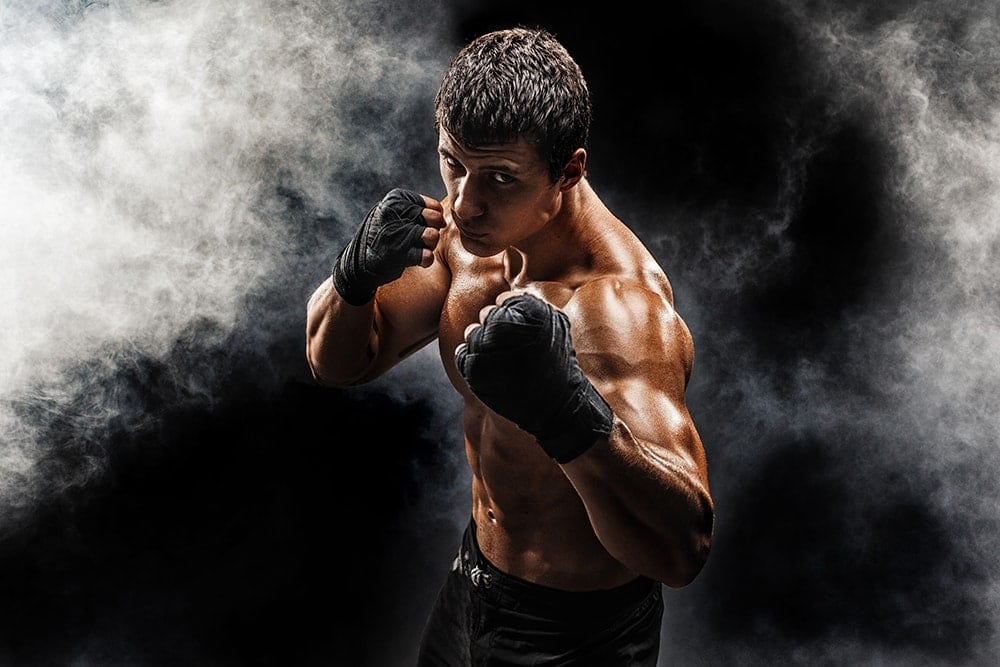 Muscular man in fighting gloves
