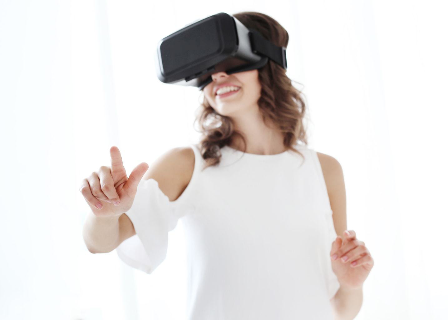 Woman playing a videogame with vr glasses