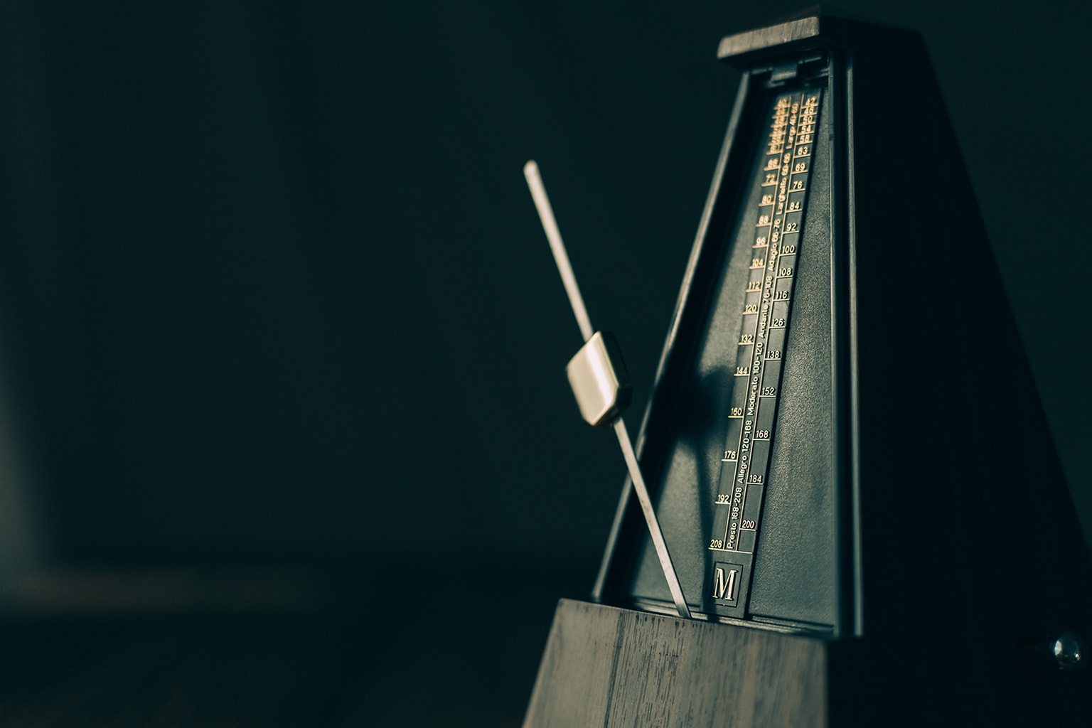 the principle of rhythm displayed with a metronome