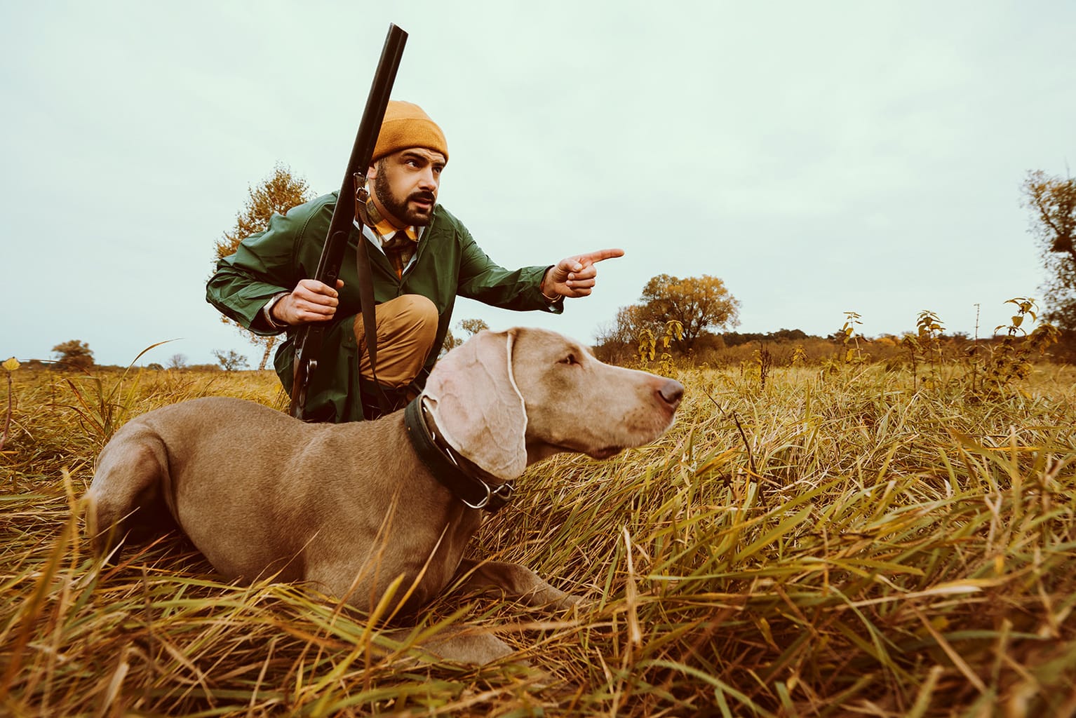 handsome man hunting with dog