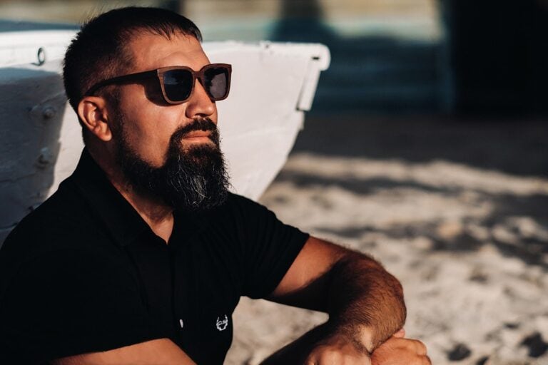 bearded sexy man with sunglasses chilling